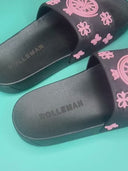 Gladys Slides: Zwarte slippers met ROLLEMAN wiel en roze bloemenpatroon