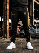 ROLLEMAN Ravi Trainingshose – Schwarz / Amber Gold